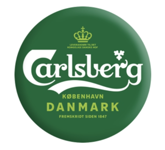 Eight shirts arranged on table in black, olive, grey, blue, white, red, mustard, and green.