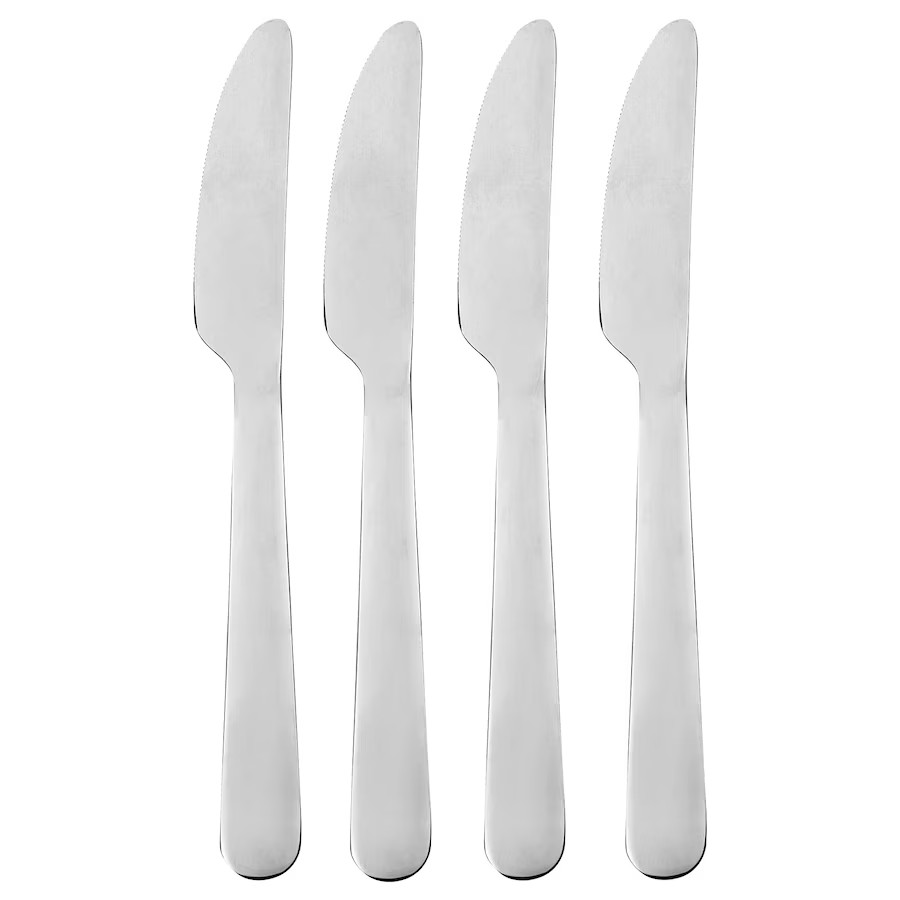 Eight shirts arranged on table in black, olive, grey, blue, white, red, mustard, and green.