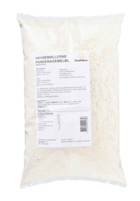 Eight shirts arranged on table in black, olive, grey, blue, white, red, mustard, and green.