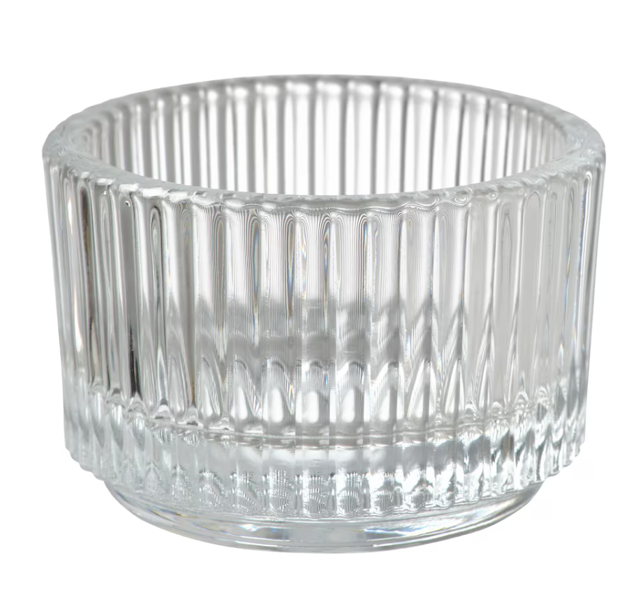 Eight shirts arranged on table in black, olive, grey, blue, white, red, mustard, and green.